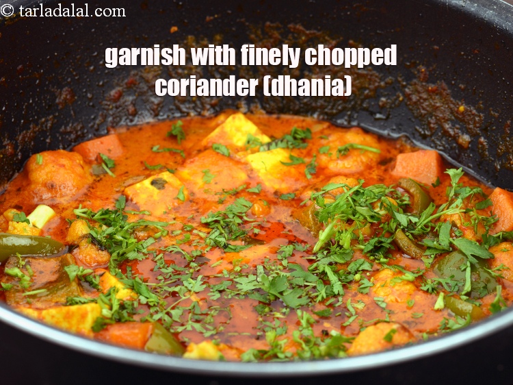 Step 50 – Garnish 2 tbsp&nbsp;finely&nbsp;<a href="https://www.tarladalal.com/glossary-chopped-coriander-783i">chopped coriander (dhania)</a>.