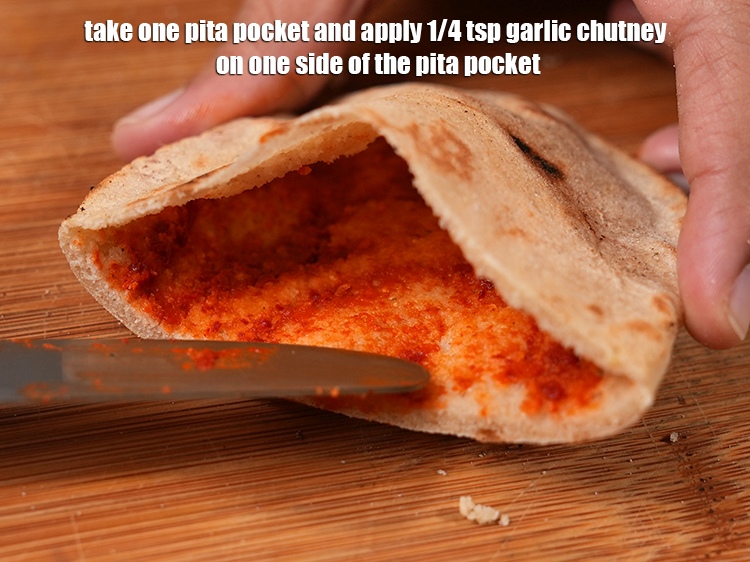 Step 51 – Take one pita pocket and apply 1/4 tsp garlic chutney on one side of the …