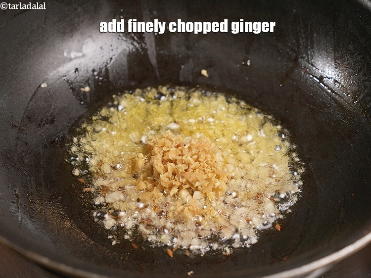 Step 50 – Add &frac12; tbsp finely <a href="https://www.tarladalal.com/glossary-chopped-ginger-786i">chopped ginger (adrak)</a>.