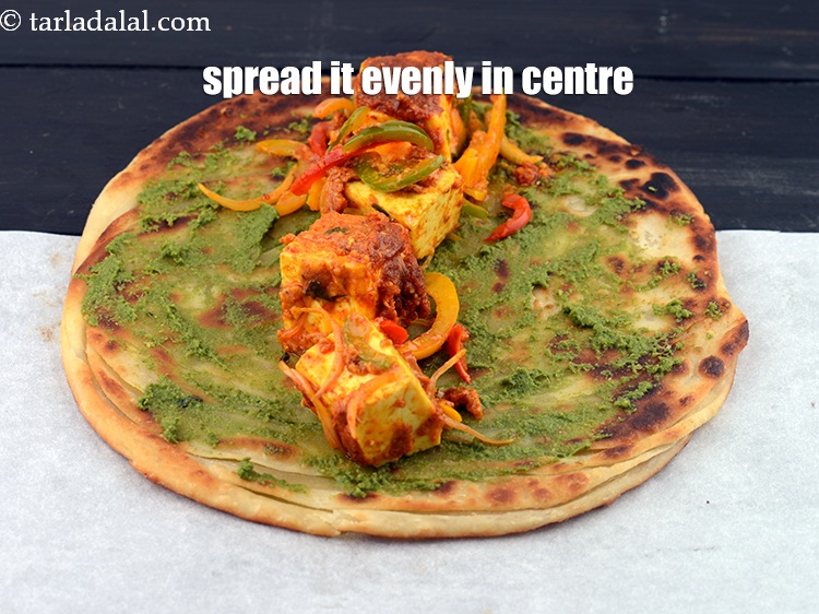 Step 56 – Apply &frac14; th of the paneer tikka stuffing in the centre and spread it evenly.&nbsp;