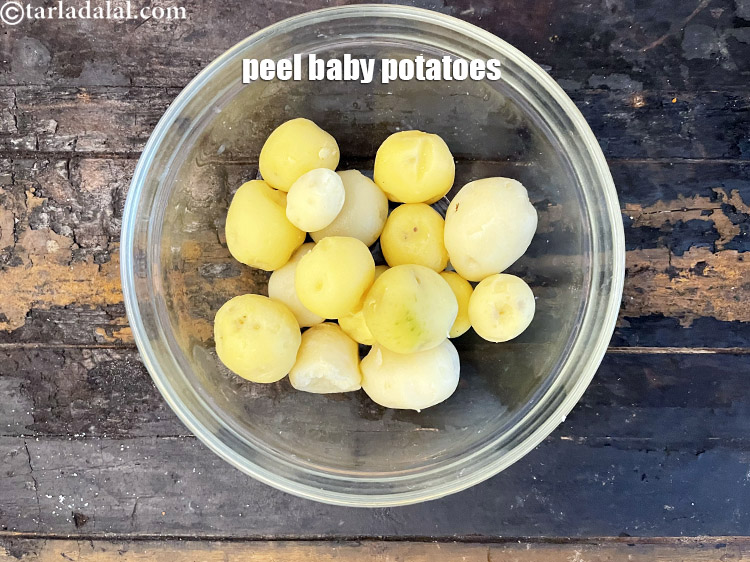 Step 10 – <meta charset="UTF-8" /> Peel the baby potatoes.&nbsp;<meta charset="UTF-8" />Your peeled and boiled baby potatoes are …