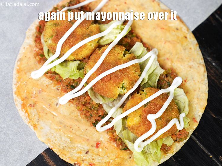 Step 51 – Again put 1 tbsp of &nbsp;<a href="https://www.tarladalal.com/glossary-mayonnaise-505i">mayonnaise</a>&nbsp;over it.&nbsp;