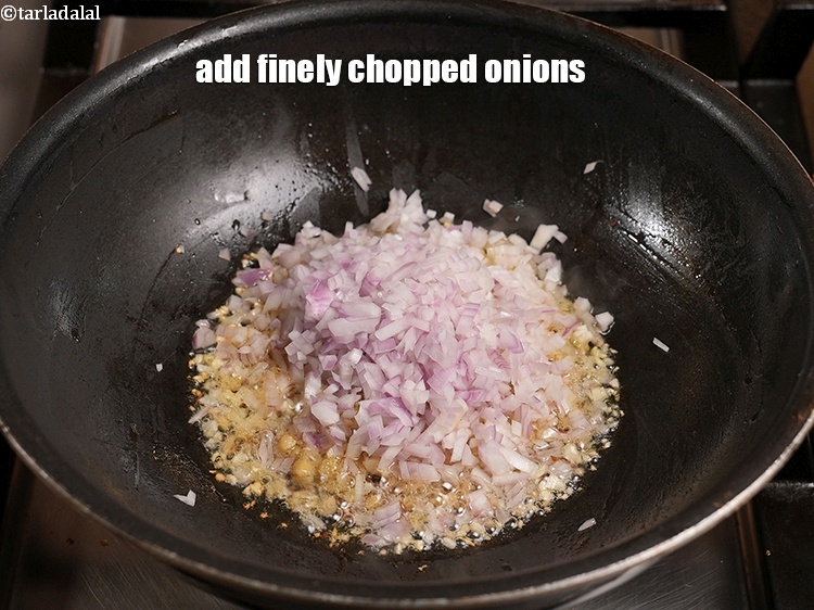 Step 51 – Add &frac12; cup finely <a href="https://www.tarladalal.com/glossary-chopped-onions-722i">chopped onions</a>.