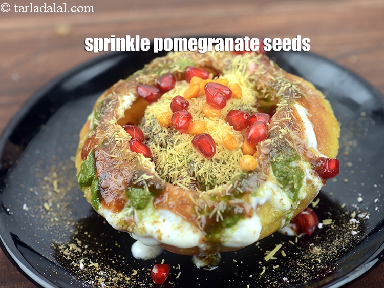 Step 54 – Sprinkle 1 tbsp <a href="https://www.tarladalal.com/glossary-pomegranate-seeds-anar-dana-anardana-seeds-588i">pomegranate seeds (anardana)</a>.