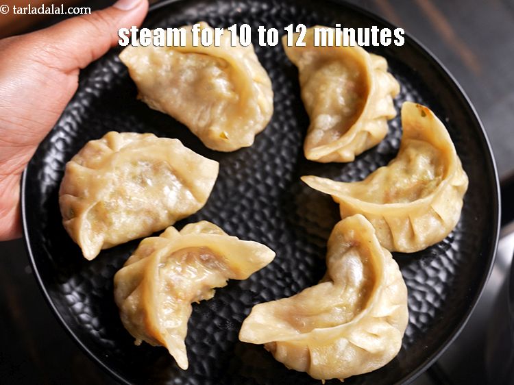 Step 53 – Steam 6 momos for 10 to 12 minutes or until they are cooked.