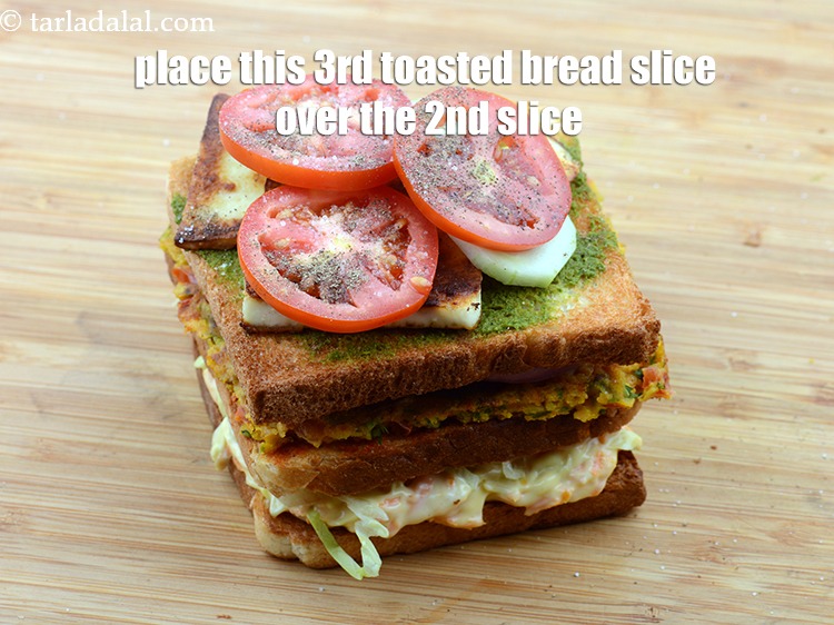 Step 52 – Place this 3rd toasted bread slice over the 2nd slice containing the omelette and onions.