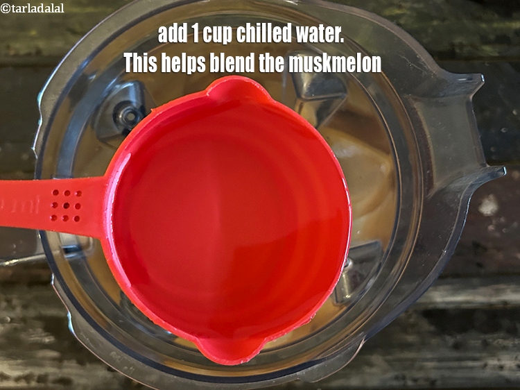 Step 10 – <meta charset="UTF-8" />Add 1 cup chilled water. This helps blend the muskmelon.&nbsp;