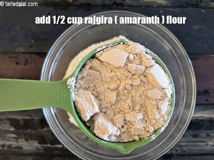 Step 6 – Add&nbsp;<meta charset="UTF-8" />1/2 cup&nbsp;<a href="glossary-rajgira-flour-ramadana-flour-amaranth-flour-rajgira-ka-atta-1297i">rajgira (amaranth) flour</a>.