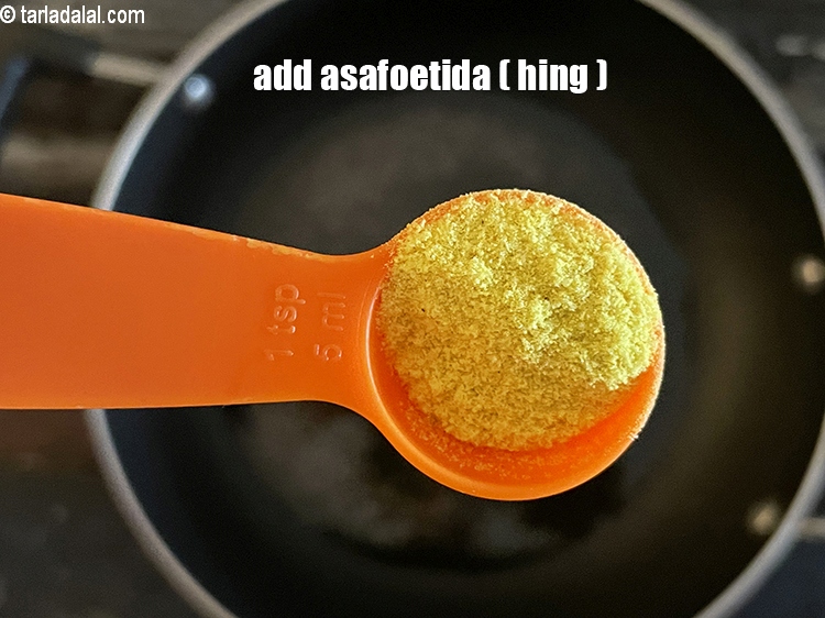 Step 6 – Add&nbsp;<meta charset="UTF-8" />3/4 tsp&nbsp;<a href="glossary-asafoetida-hing-113i">asafoetida (hing)</a>.