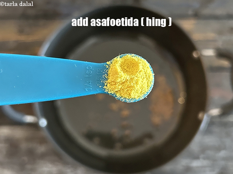 Step 6 – Add&nbsp;<meta charset="UTF-8" />1/4 tsp&nbsp;<a href="glossary-asafoetida-hing-113i">asafoetida (hing)</a>.