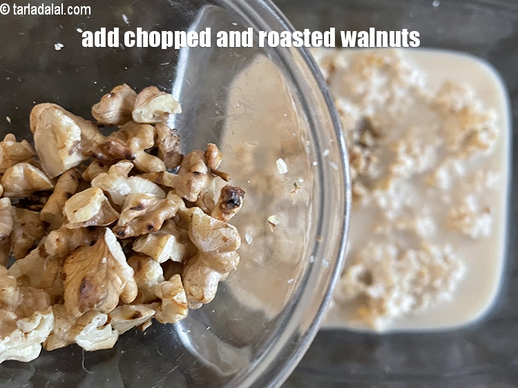 Step 14 – Add&nbsp;2 tsp roasted and &nbsp;<a href="https://tarladalal.com/glossary-chopped-walnuts-785i">chopped walnuts (akhrot)</a>.