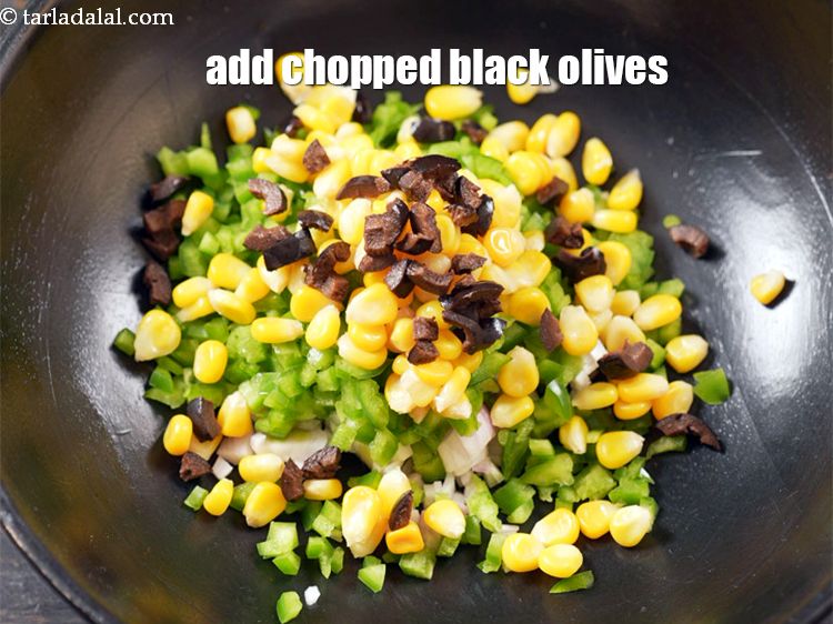 Step 6 – Add 2 tbsp <a href="https://www.tarladalal.com/glossary-chopped-black-olives-1021i">chopped black olives</a>.