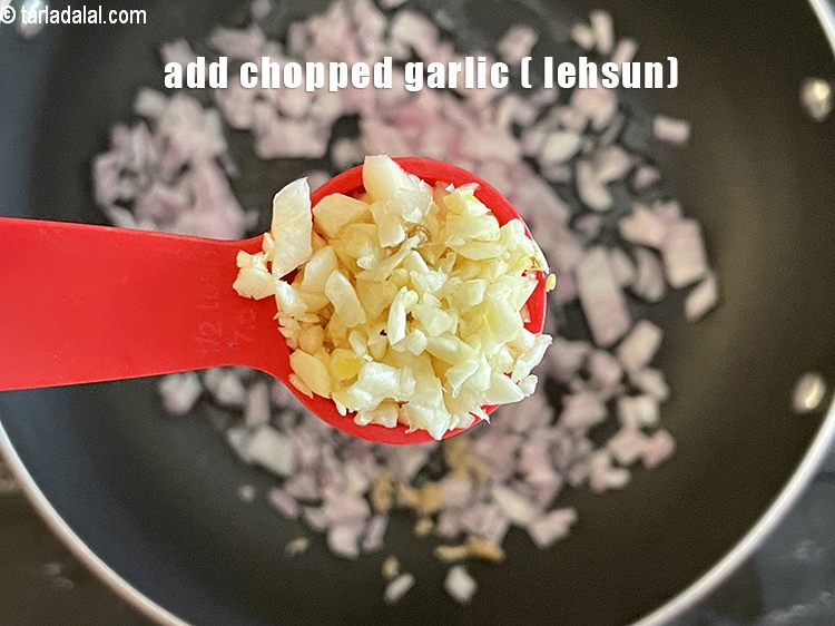 Step 26 – <meta charset="UTF-8" /> Add&nbsp;1/2 tbsp&nbsp;<a href="glossary-chopped-garlic-790i">chopped garlic (lehsun)</a>.