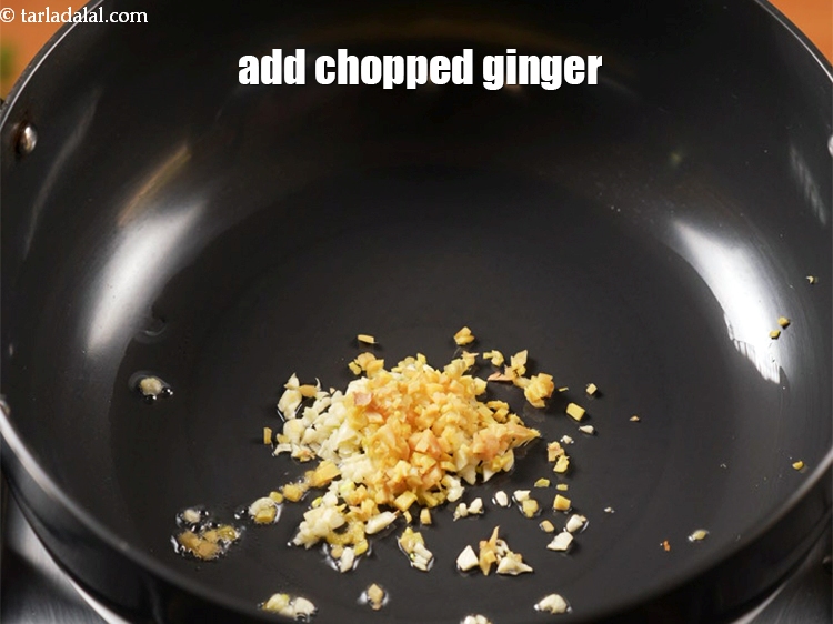 Step 10 – Add &frac12; tbsp of <a href="https://www.tarladalal.com/glossary-chopped-ginger-786i">chopped ginger (adrak)</a>.