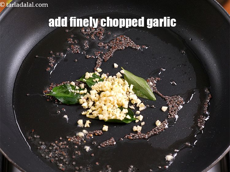 Step 6 – Add 1 tbsp finely <a href="https://www.tarladalal.com/glossary-chopped-garlic-790i">chopped garlic (lehsun)</a>.