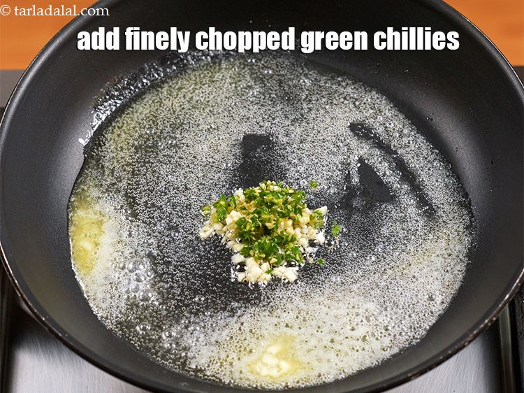 Step 8 – Add 1 tsp finely <a href="https://www.tarladalal.com/glossary-chopped-green-chilli-820i">chopped green chillies</a>.&nbsp;