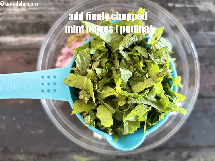 Step 19 – Add&nbsp;<meta charset="UTF-8" />1/2 cup&nbsp;finely&nbsp;<a href="glossary-chopped-mint-788i">chopped mint leaves (phudina)</a>.