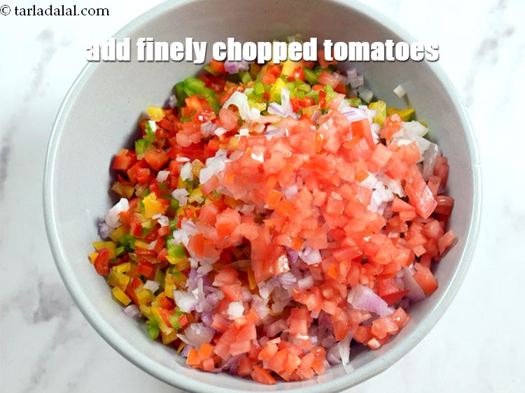 Step 7 – Add &frac14; cup deseeded and finely <a href="https://www.tarladalal.com/glossary-chopped-tomatoes-779i">chopped tomatoes</a>.