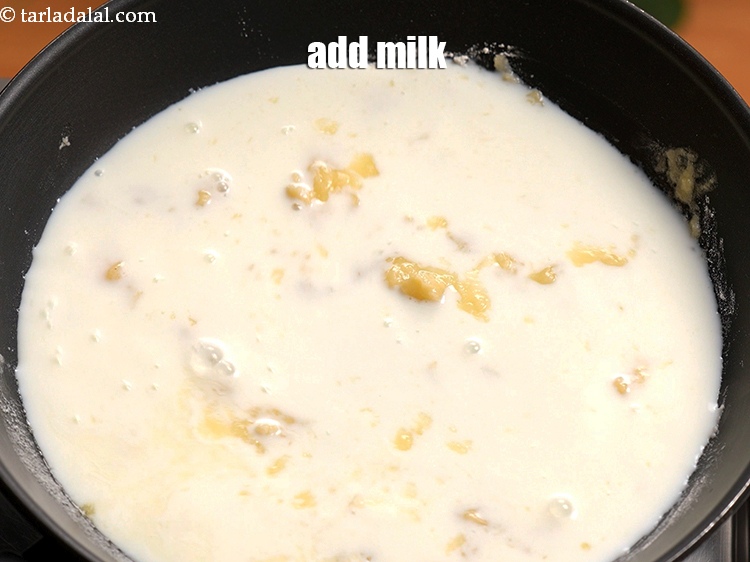 Step 6 – Add 1 cup <a href="https://www.tarladalal.com/glossary-milk-doodh-full-cream-milk-514i">milk</a>.