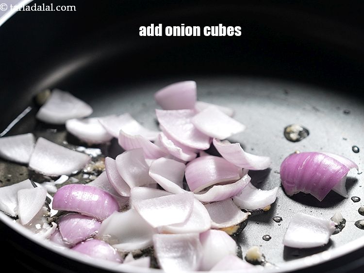 Step 14 – Add 1/2 cup&nbsp;<a href="https://www.tarladalal.com/glossary-onion-cubes-732i">onion cubes</a>.&nbsp;