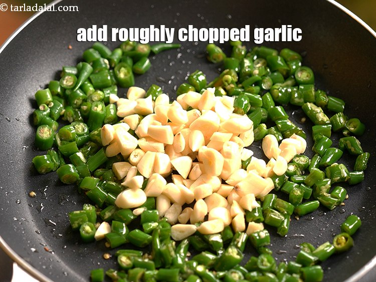 Step 6 – Add 4 tbsp&nbsp;roughly&nbsp;<a href="https://www.tarladalal.com/glossary-chopped-garlic-790i">chopped garlic (lehsun)</a>.&nbsp;