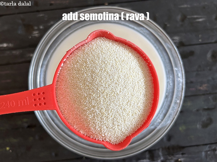 Step 7 – Add&nbsp;<!--%3Cmeta%20charset%3D%22UTF-8%22%20%2F%3E-->2 1/2 cups&nbsp;<a href="glossary-semolina-sooji-rava-rawa-603i">semolina (rava)</a>.