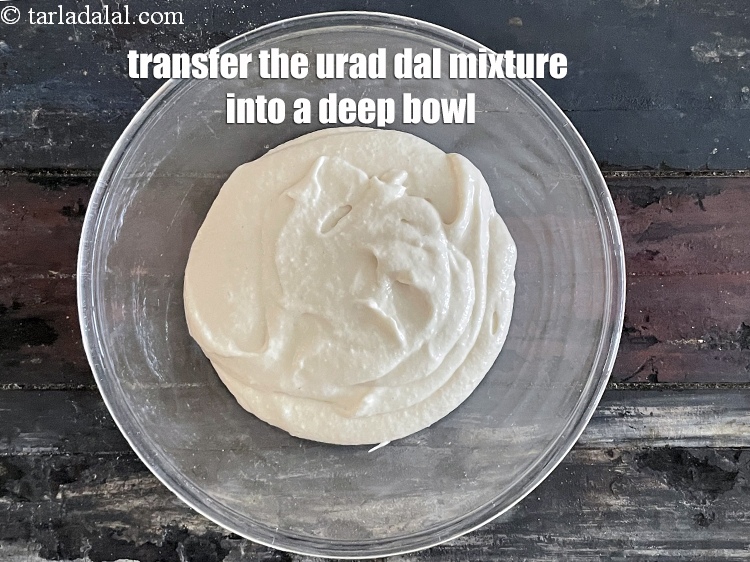 Step 11 – In a mixer put the soaked and drained urad dal.