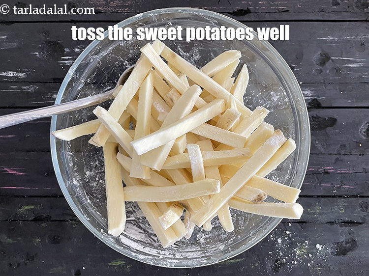 Step 13 – Toss the potatoes, so that it mixes well with&nbsp;cornflour and sea salt.