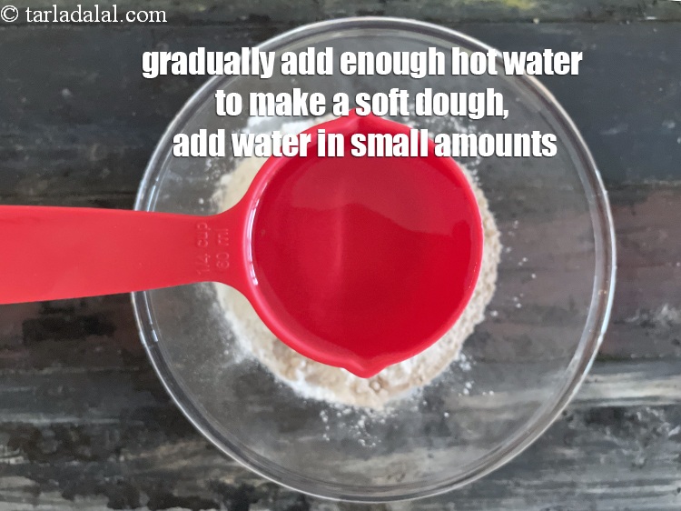 Step 7 – <meta charset="UTF-8" /><u><em>Gradually add enough hot water to make a soft dough.&nbsp;</em></u>We added 1/2&nbsp;cup&nbsp;water plus …