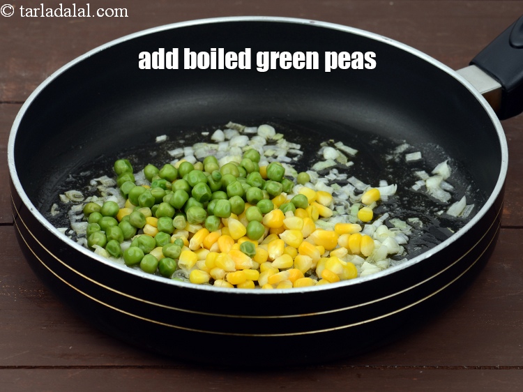 Step 6 – Add 1/4 cup&nbsp;<a href="https://tarladalal.com/glossary-boiled-green-peas-1078i">boiled green peas</a>.
