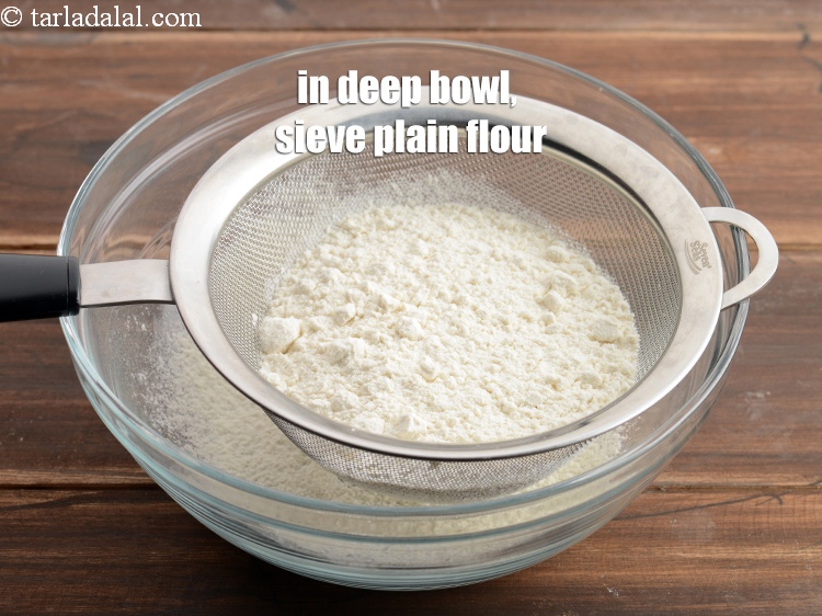 Step 8 – In a deep bowl, sieve 1 cup <a href="https://www.tarladalal.com/glossary-plain-flour-maida-188i">plain flour (maida)</a>.