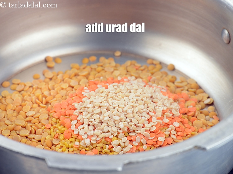 Step 7 – Add 2 tsp <a href="https://www.tarladalal.com/glossary-urad-dal-split-black-lentil-941i">urad dal (split black lentils)</a>&nbsp;, washed and drained.