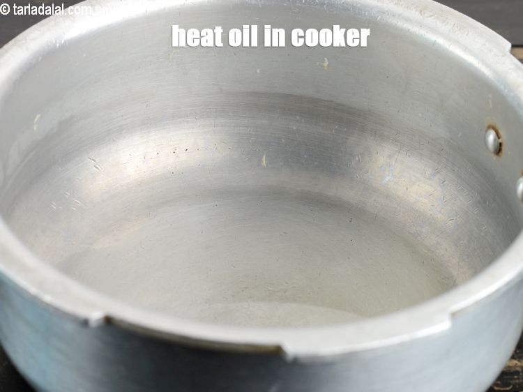 Step 6 – Heat 1 tsp oil in a pressure cooker.