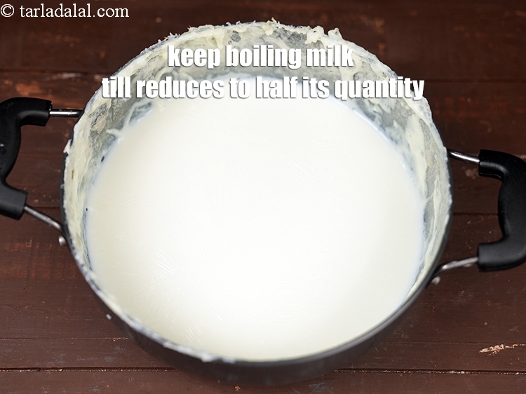 Step 7 – Keep boiling the milk till it reduces to half its quantity, while stirring occasionally. It …