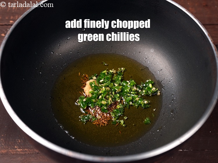 Step 7 – Add 2 tsp finley <a href="https://www.tarladalal.com/glossary-chopped-green-chilli-820i">chopped green chillies</a>.