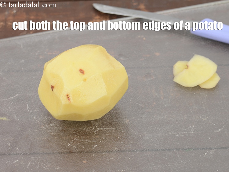 Step 8 – Cut both the top and bottom edges of a potato.