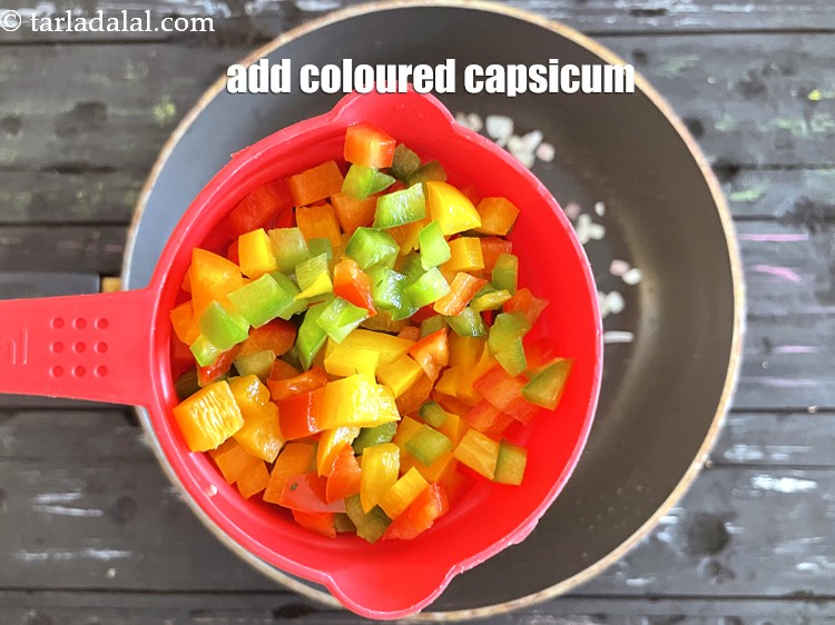 Step 14 – Add&nbsp;<meta charset="UTF-8" />3/4 cup&nbsp;finely&nbsp;<a href="glossary-chopped-capsicum-164i">chopped coloured capsicum</a>.