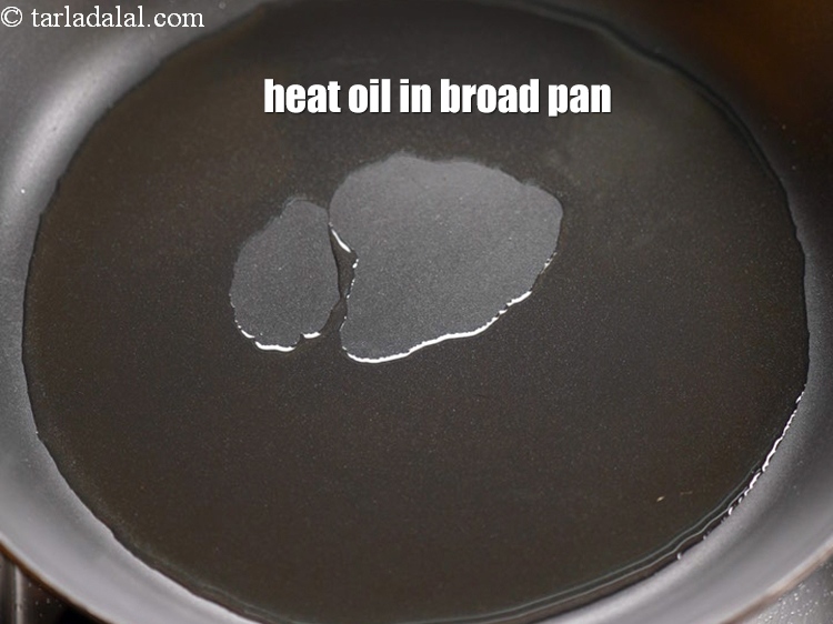 Step 6 – Heat 2 tbsp oil in a broad non-stick pan.