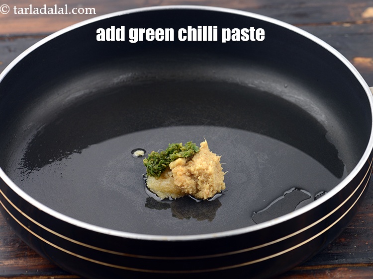 Step 6 – Add 1 tsp&nbsp;<a href="https://www.tarladalal.com/glossary-green-chilli-paste-hari-mirch-ki-paste-mirchi-paste-333i">green chilli paste</a>.