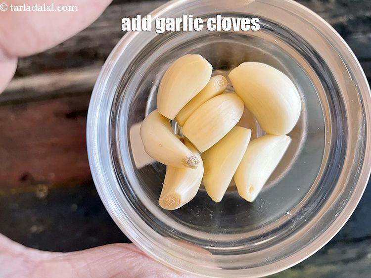 Step 6 – Add&nbsp;<!--%3Cmeta%20charset%3D%22UTF-8%22%20%2F%3E-->8&nbsp;<a href="glossary-garlic-cloves-1857i">cloves garlic (lehsun)</a>.