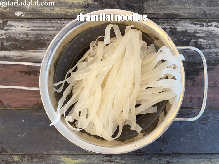 Step 6 – Drain the flat noodles.