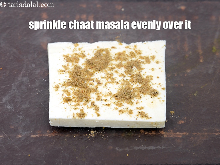 Step 17 – Sprinkle little <a href="https://www.tarladalal.com/glossary-chaat-masala-300i">chaat masala</a>&nbsp;evenly over it.&nbsp;