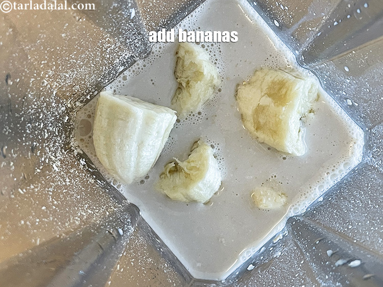 Step 10 – Add&nbsp;<meta charset="UTF-8" />2&nbsp;large ripe&nbsp;<a href="glossary-banana-kela-17i">bananas</a>&nbsp;broken into pieces.