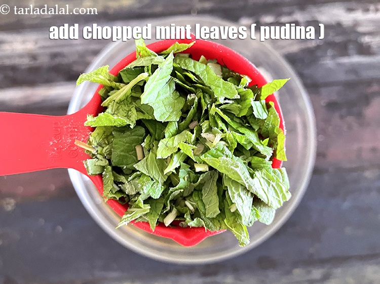 Step 9 – Add&nbsp;<meta charset="UTF-8" />1/4 cup&nbsp;finely&nbsp;<a href="glossary-chopped-mint-788i">chopped mint leaves (phudina)</a>.