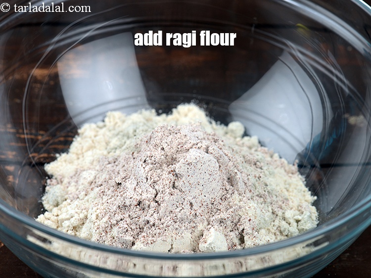 Step 6 – Add 2 tbsp&nbsp;<a href="https://www.tarladalal.com/glossary-ragi-flour-nachni-flour-nachni-ka-atta-red-millet-flour-1115i">ragi (nachni / red millet) flour</a>.&nbsp;<br /> &nbsp;