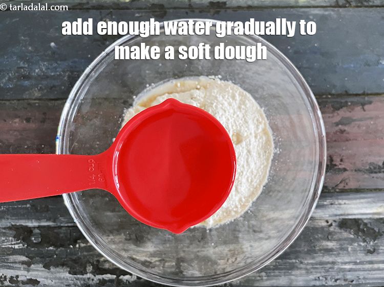Step 6 – Add enough water gradually to make a soft dough. We first added 1/4 cup water. …