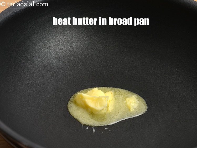 Step 9 – To make white sauce, heat 1 tbsp <a href="https://www.tarladalal.com/glossary-butter-makhan-233i">butter</a> in a broad non-stick pan.