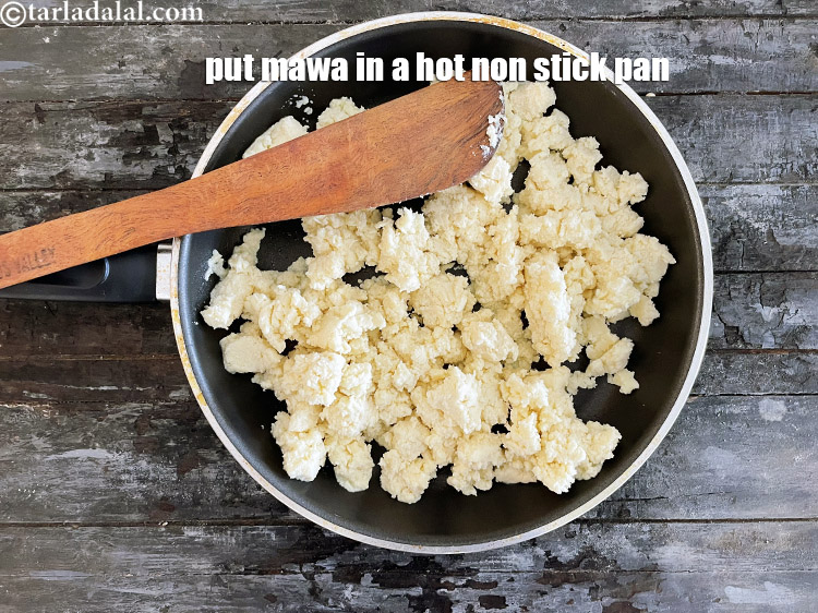 Step 7 – In a hot broad non-stick pan put&nbsp;2 cups (1/2 kg) crumbled mawa.