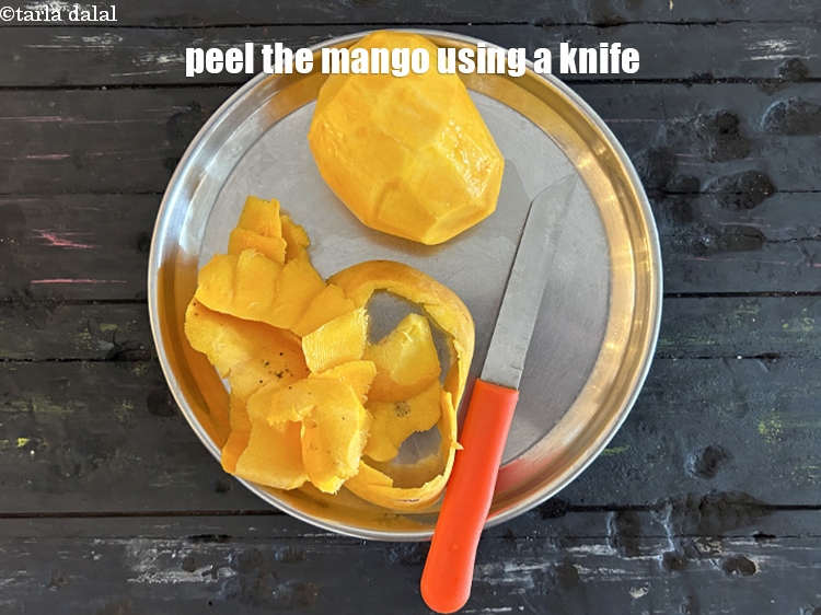 Step 13 – Peel the mango using a knife.&nbsp;
