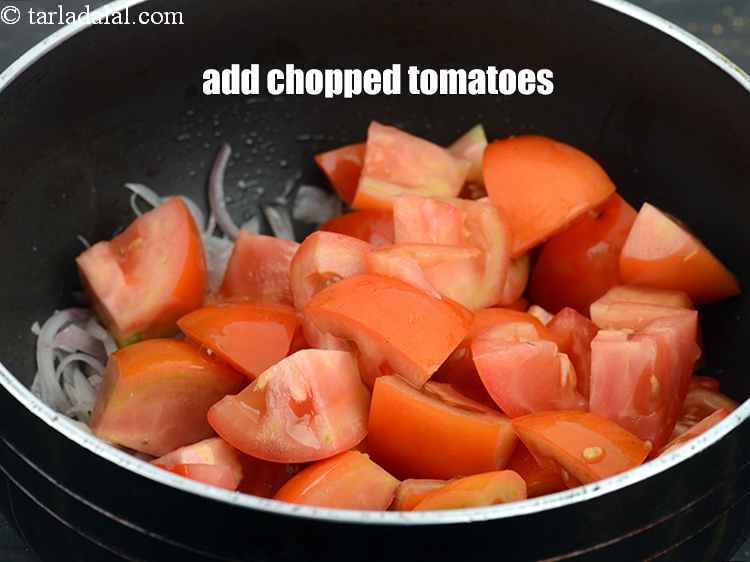 Step 7 – Add 2 cups roughly&nbsp;<a href="https://www.tarladalal.com/glossary-chopped-tomatoes-779i">chopped tomatoes</a>.